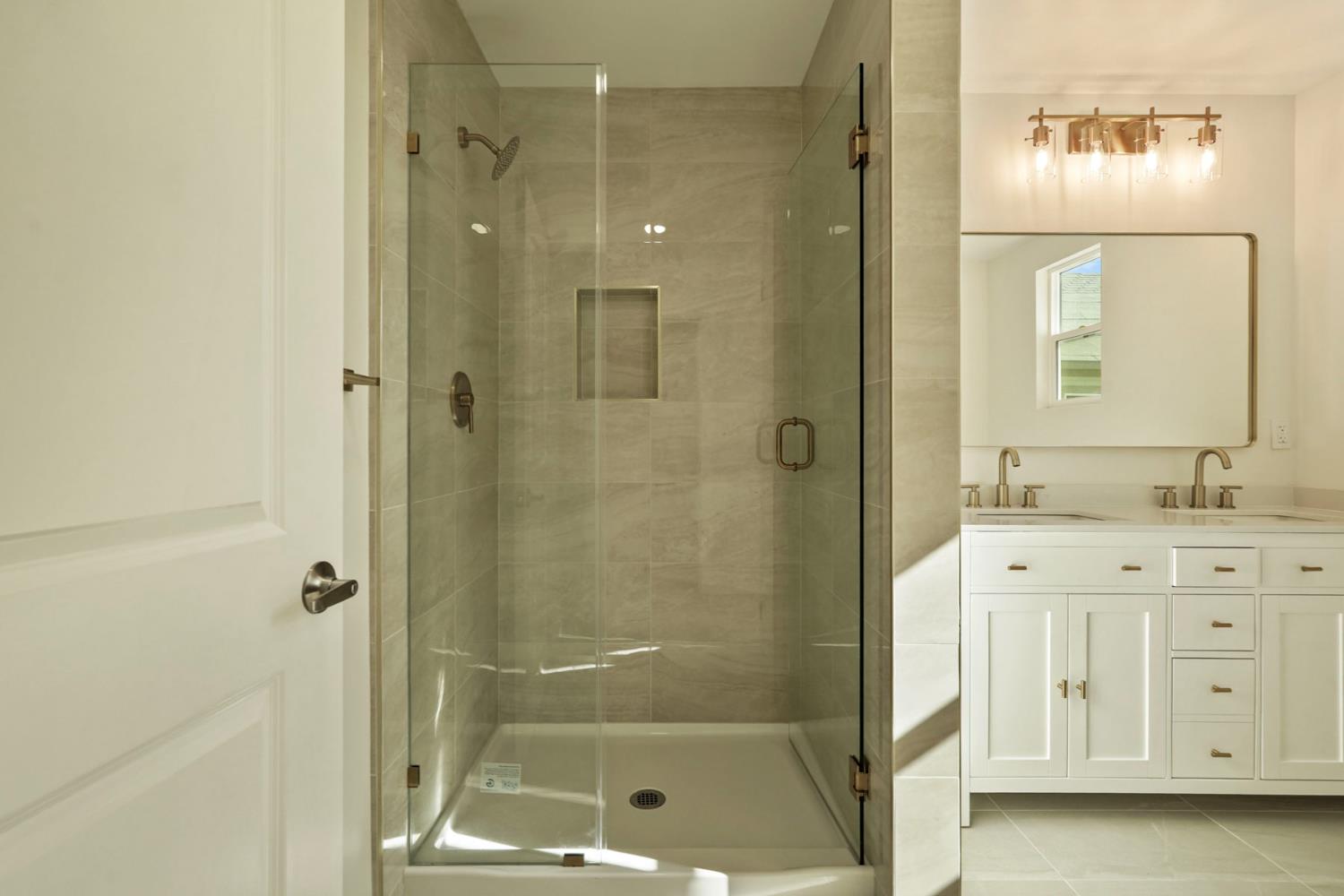 1269 B Street Walnut Grove, CA 95690 - Photo 31 of 42 a bathroom with a shower a sink and a mirror