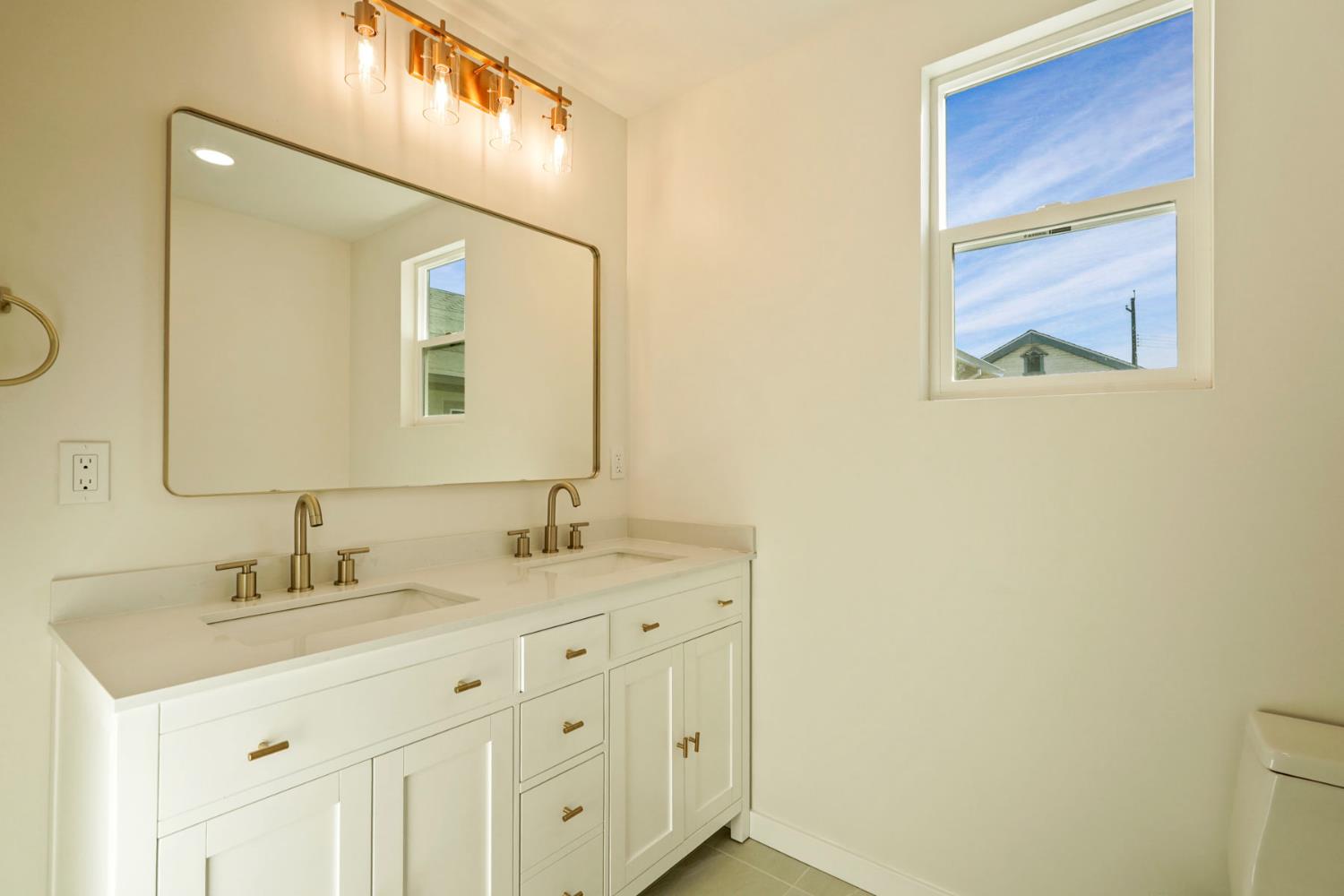 1269 B Street Walnut Grove, CA 95690 - Photo 32 of 42 a bathroom with a sink and a mirror