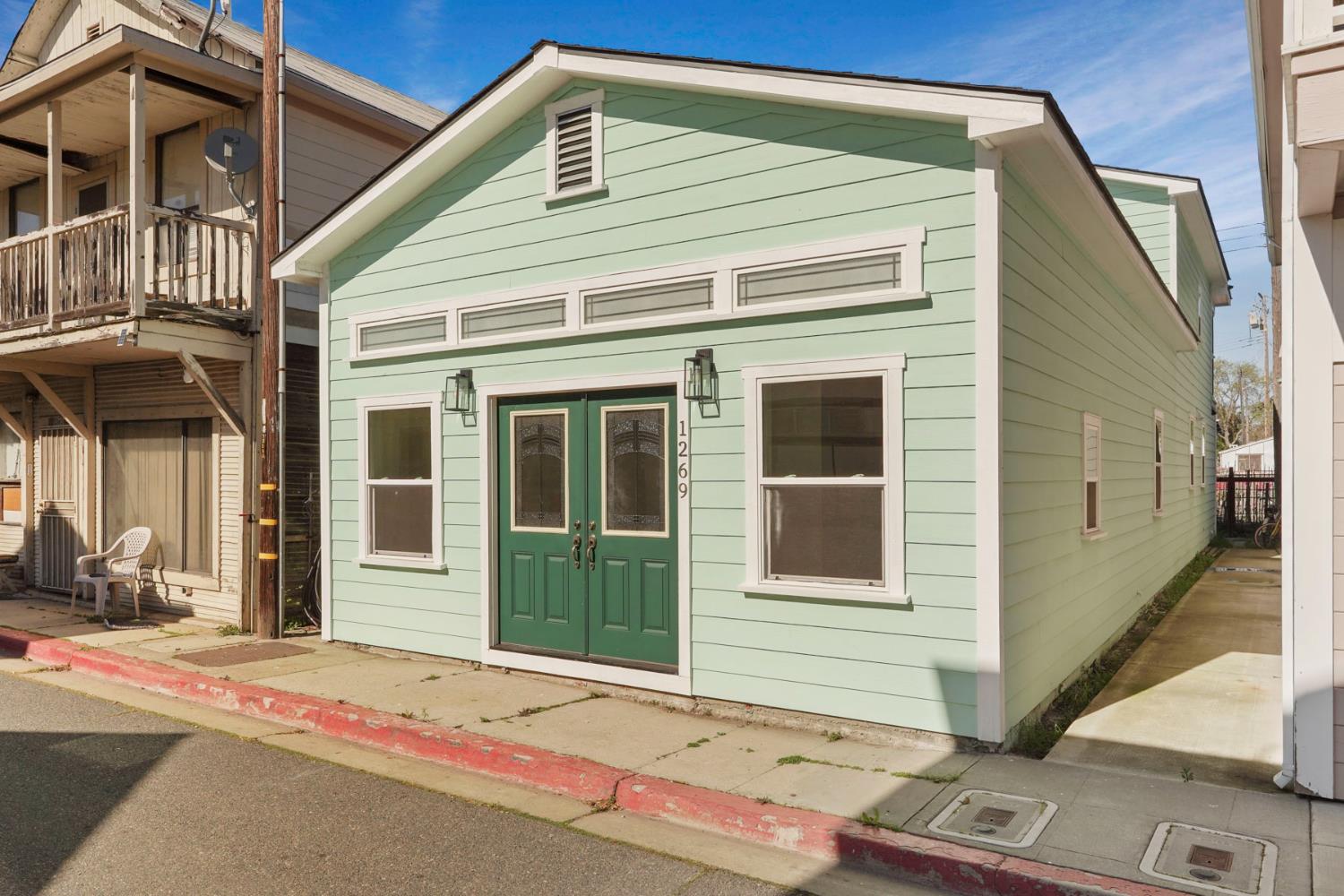 1269 B Street Walnut Grove, CA 95690 - Photo 40 of 42 a front view of a house with a garage