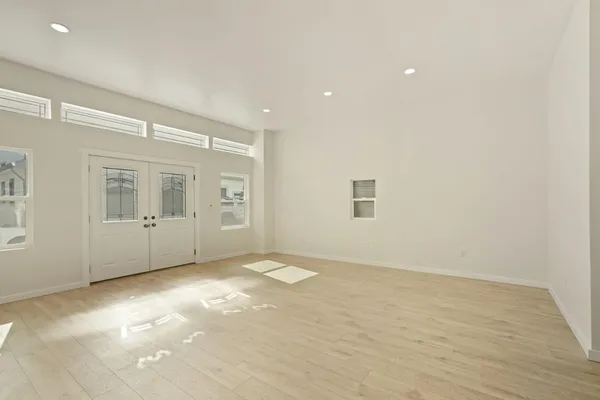 a bathroom with a double vanity sink mirror and toilet