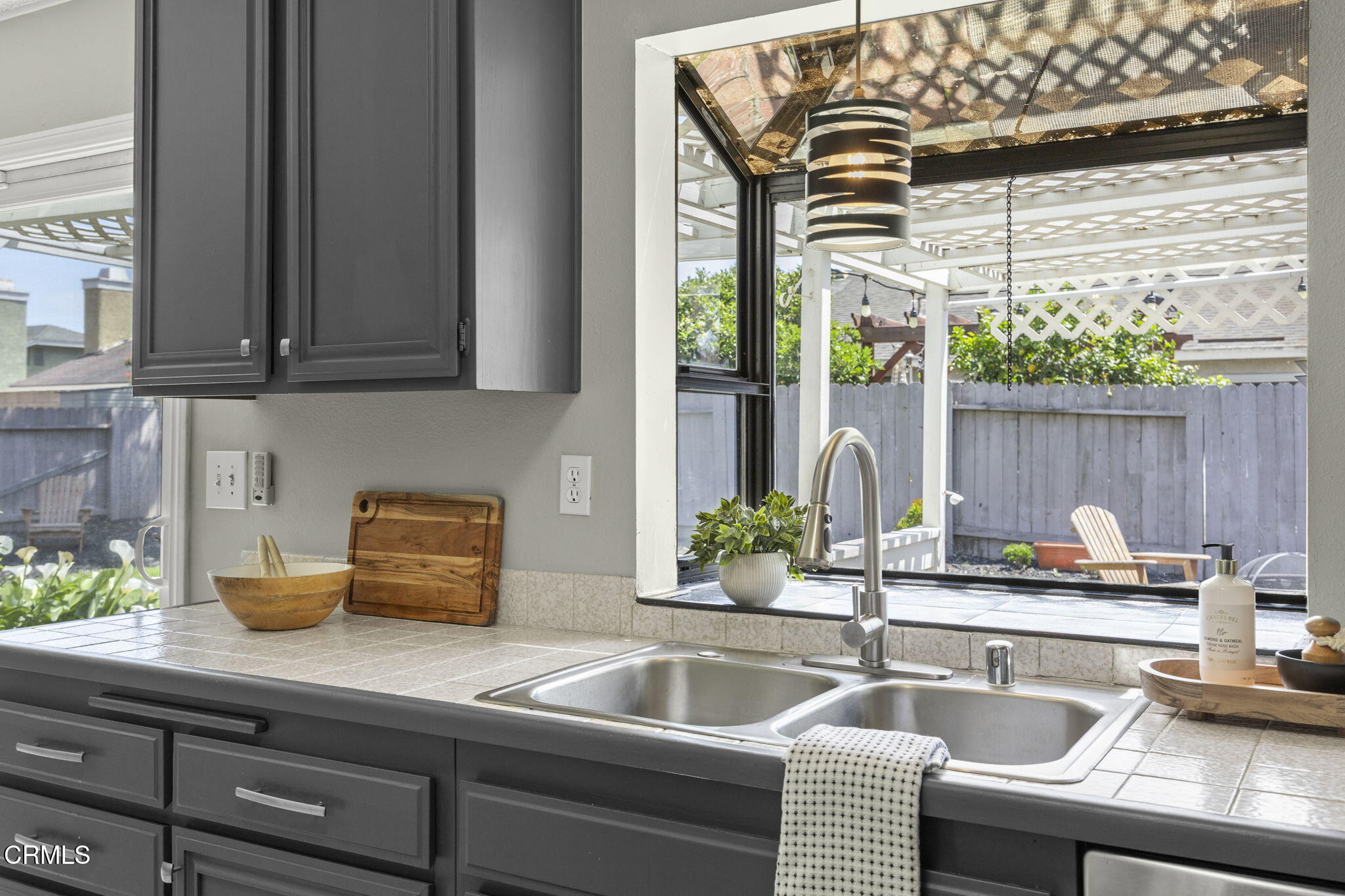 2730 Oarfish Lane Oxnard, CA 93035 - Photo 13 of 49 a kitchen with a sink and a potted plant