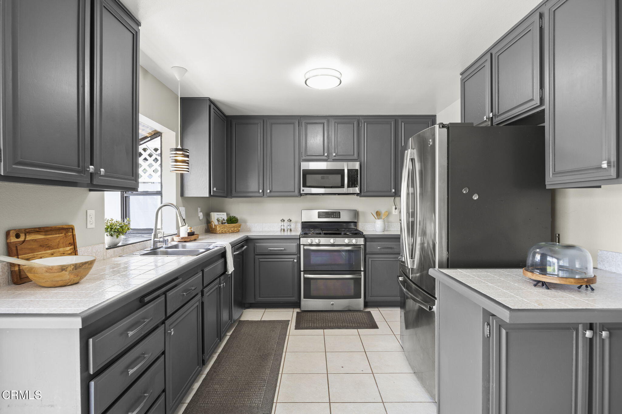 2730 Oarfish Lane Oxnard, CA 93035 - Photo 15 of 49 a kitchen with a sink a stove and refrigerator