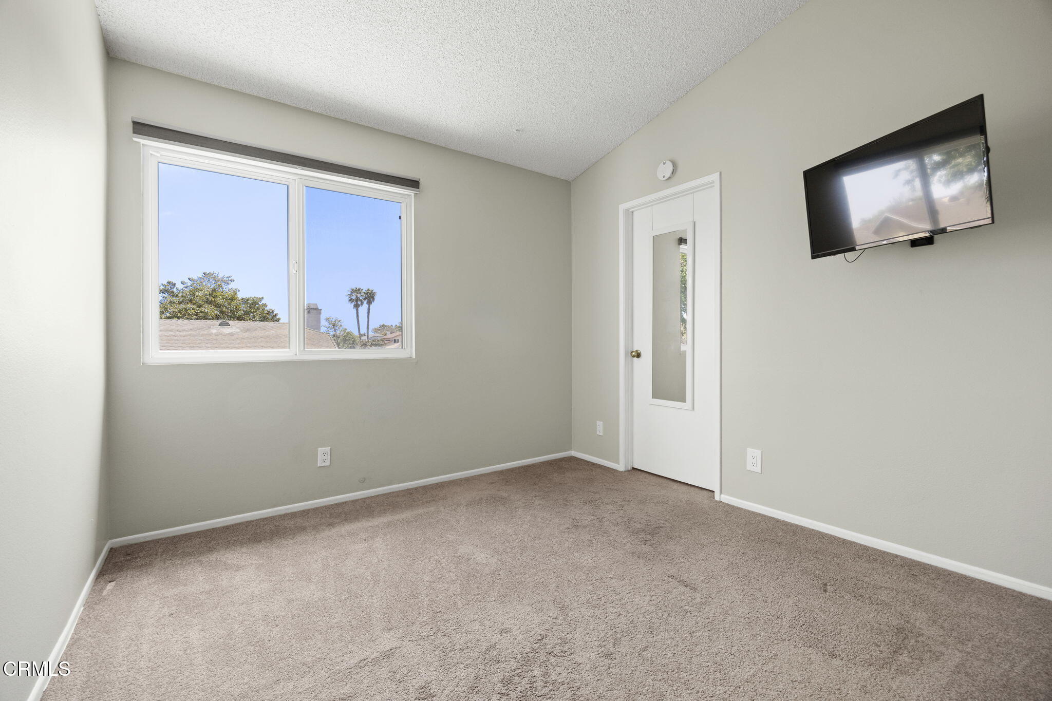 2730 Oarfish Lane Oxnard, CA 93035 - Photo 29 of 49 an empty room with windows and wall painting