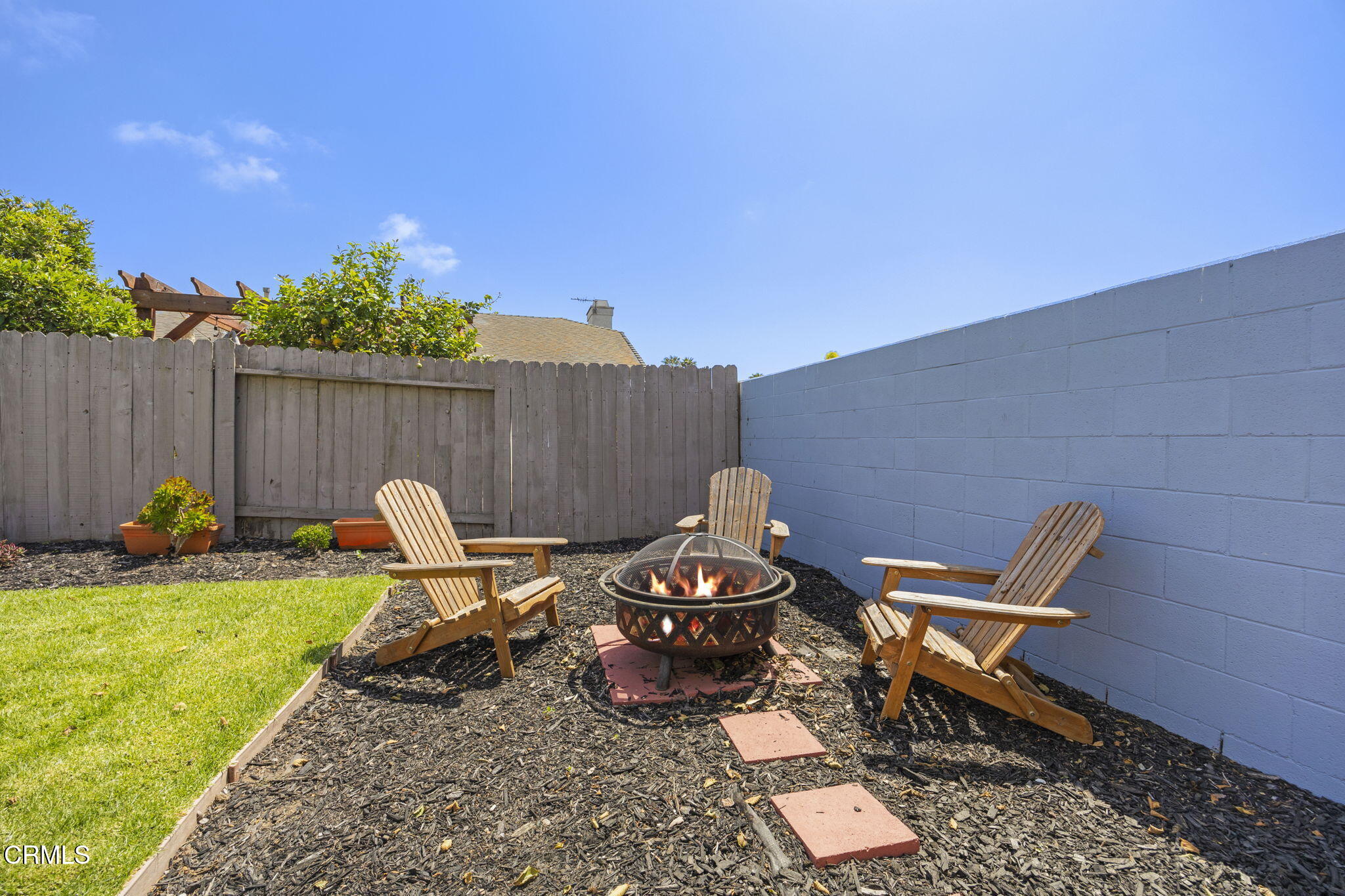 2730 Oarfish Lane Oxnard, CA 93035 - Photo 38 of 49 a view of a backyard with chairs and a grill