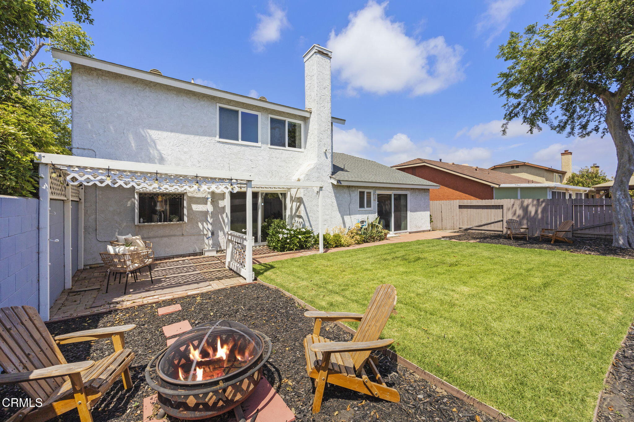 2730 Oarfish Lane Oxnard, CA 93035 - Photo 39 of 49 a house view with a sitting space and garden