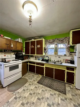 a kitchen with stainless steel appliances granite countertop a stove and a sink