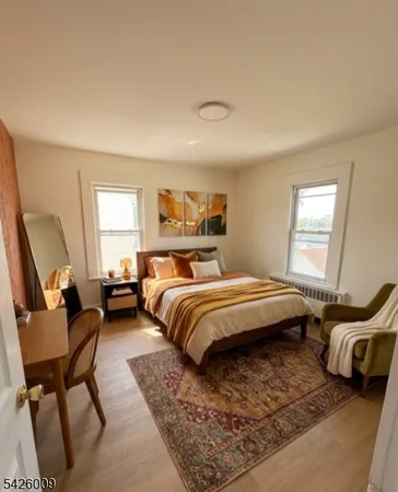 a bedroom with a bed and a chair
