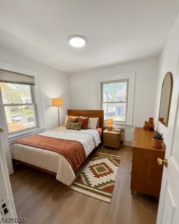 a bedroom with bed and window