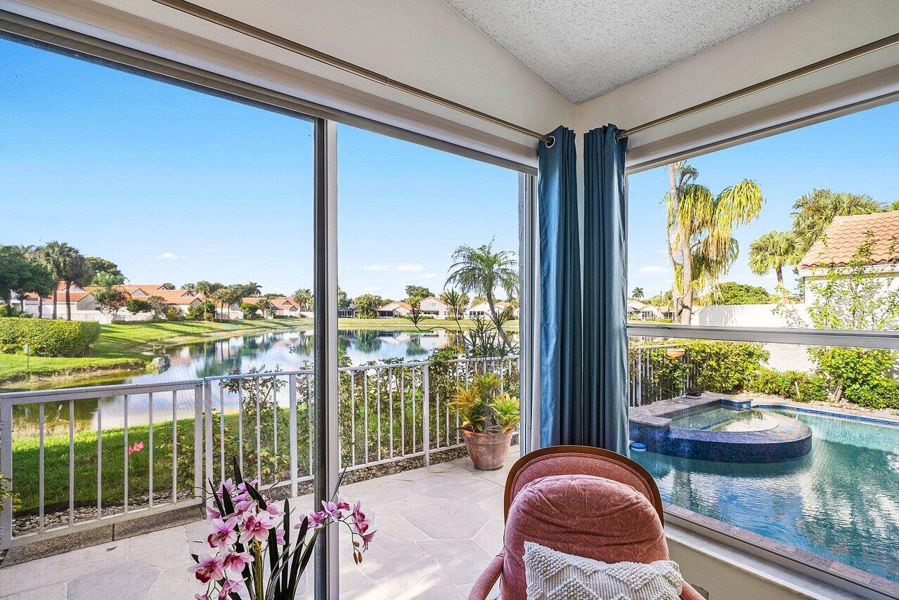 7155 Via Palomar Boca Raton, FL 33433 - Photo 18 of 45 a room with furniture and a large window