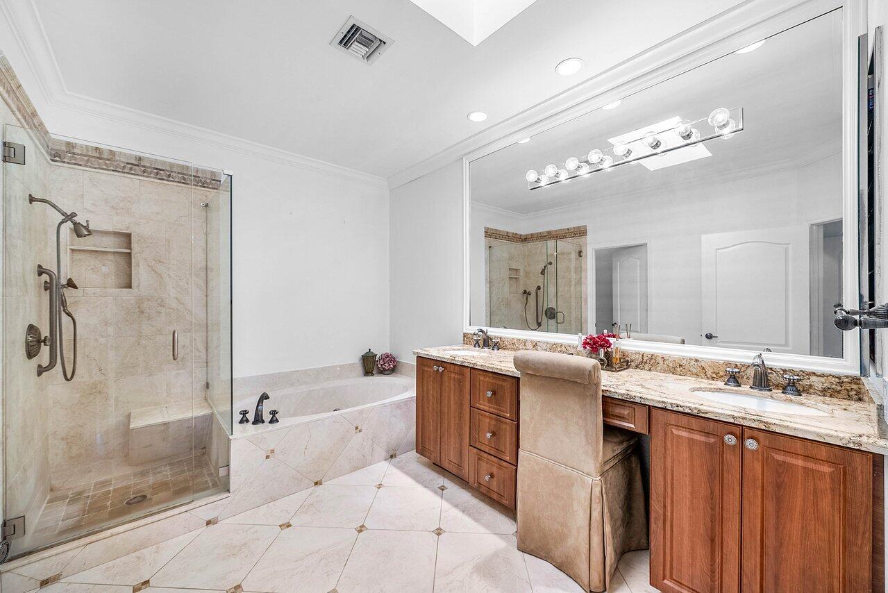 7155 Via Palomar Boca Raton, FL 33433 - Photo 20 of 45 a bathroom with a tub a sink shower and mirror