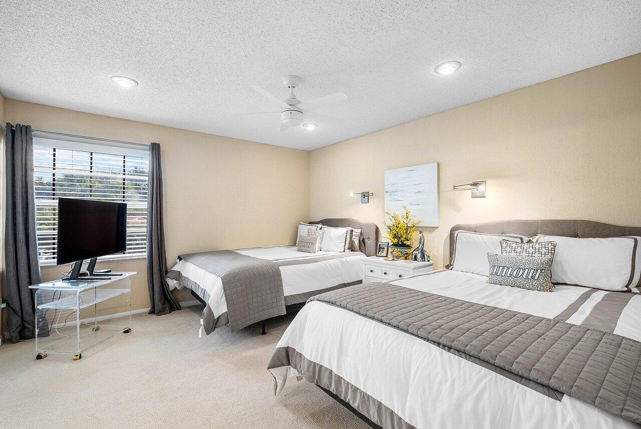 7155 Via Palomar Boca Raton, FL 33433 - Photo 25 of 45 a bedroom with two beds and a flat screen tv