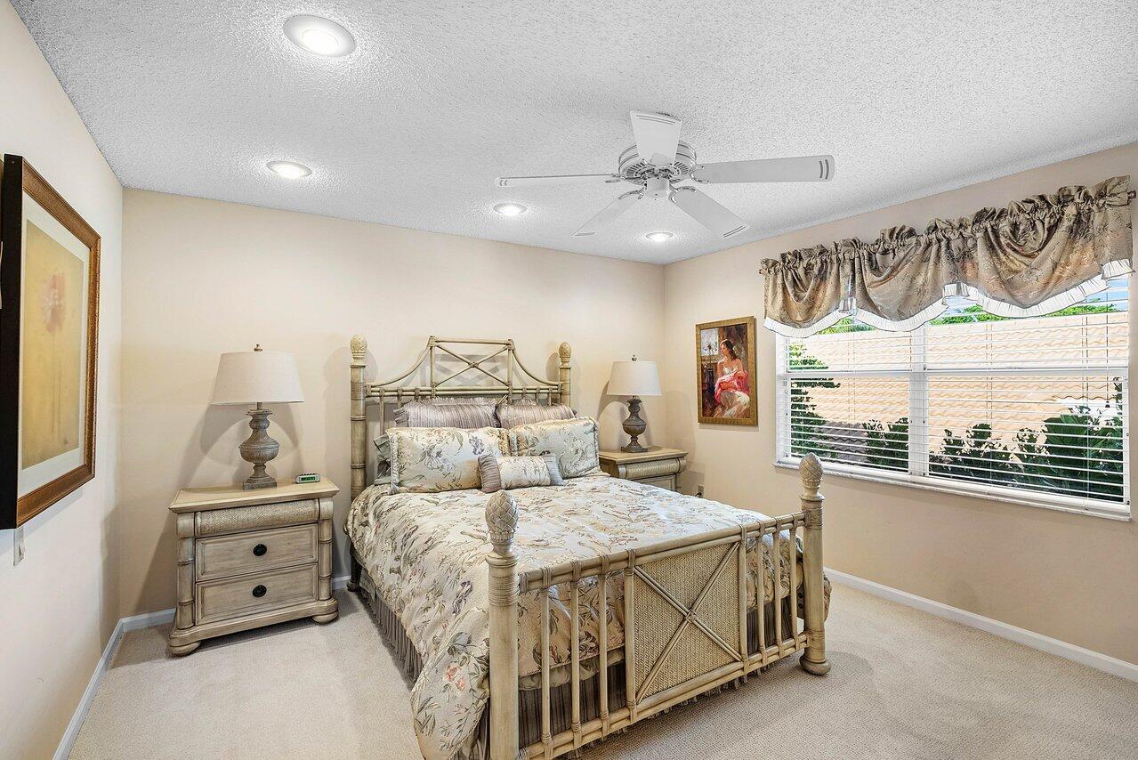 7155 Via Palomar Boca Raton, FL 33433 - Photo 29 of 45 a bedroom with a large bed and a large window