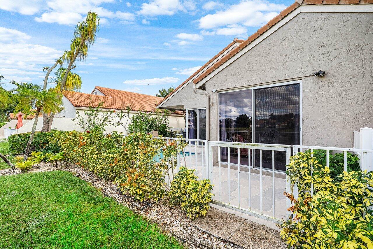 7155 Via Palomar Boca Raton, FL 33433 - Photo 36 of 45 a house view with a garden space