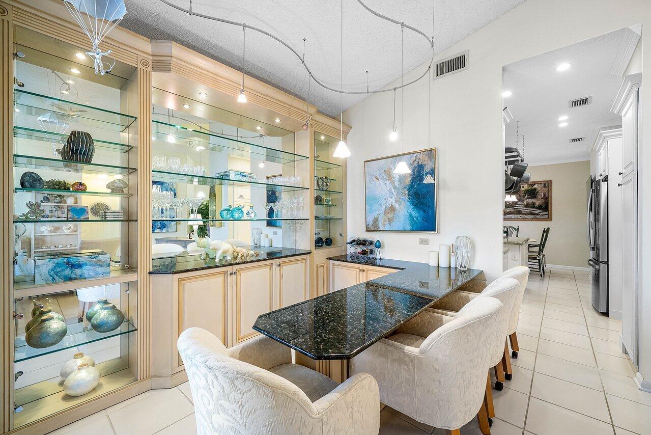 7155 Via Palomar Boca Raton, FL 33433 - Photo 10 of 45 a large kitchen with a table and chairs