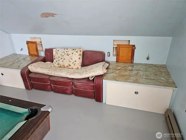 a room with pool table and windows