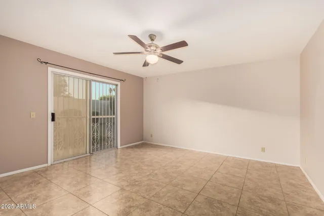a bathroom with a granite countertop sink a toilet a mirror and shower