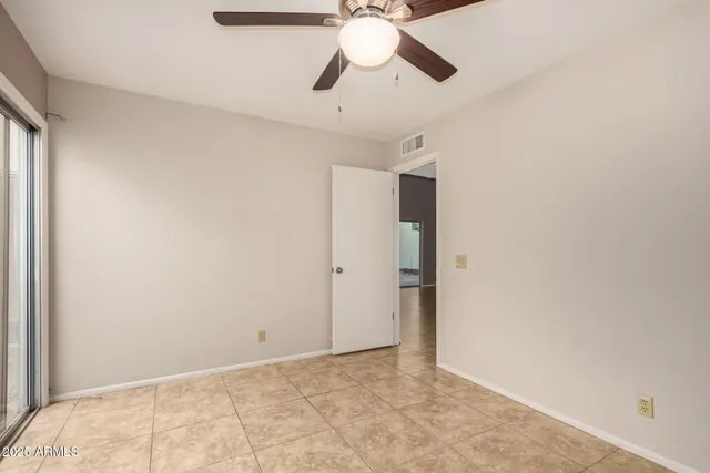 a view of a house with potted plants