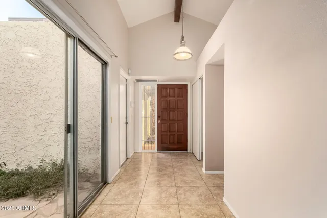 a large kitchen with kitchen island granite countertop a sink and a stove