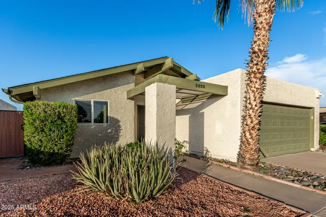 a view of a house with a garage