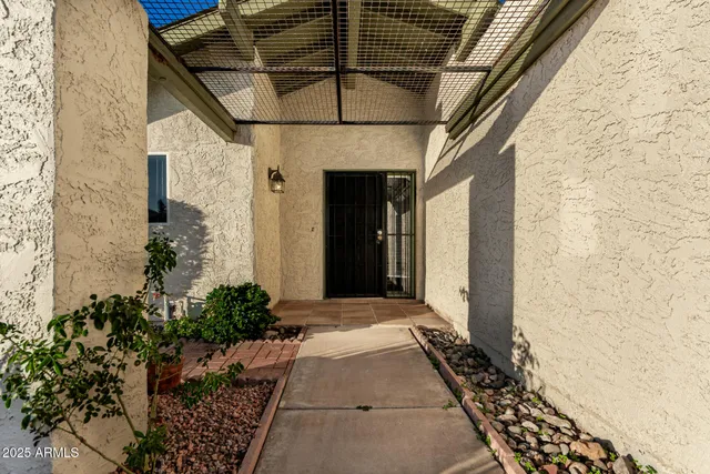 an empty room with fan and windows