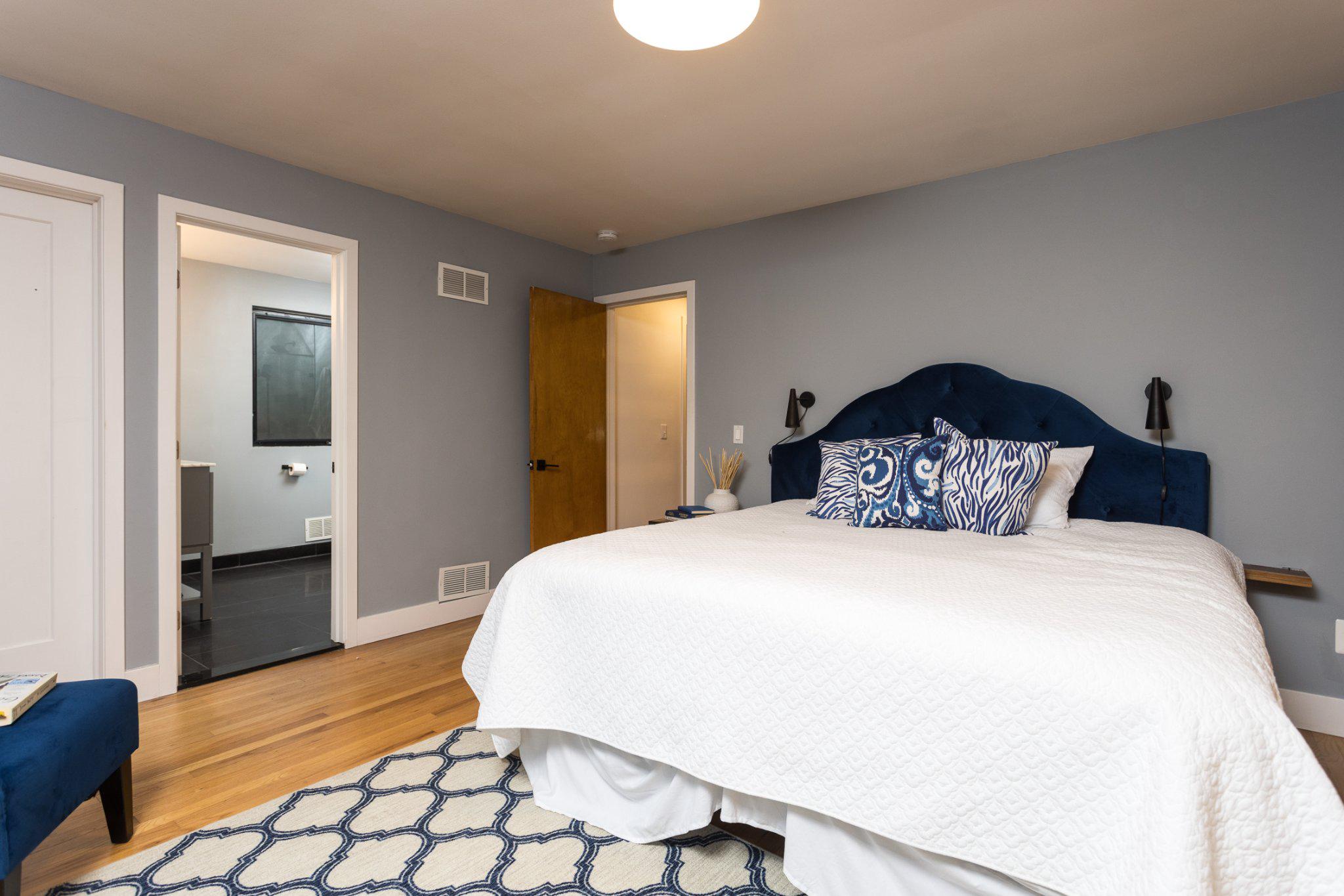 7006 Copeleigh Road Baltimore, MD 21212 - Photo 24 of 43 a bedroom with a bed and wooden floor