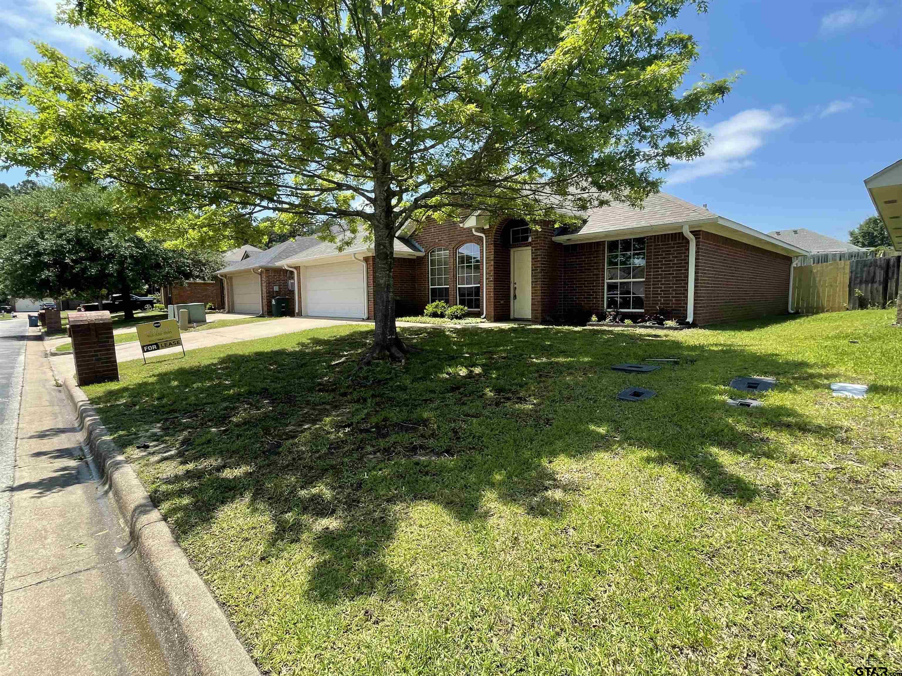 213 Cass Circle Tyler, TX 75703 - Photo 14 of 44 a house view with a garden space