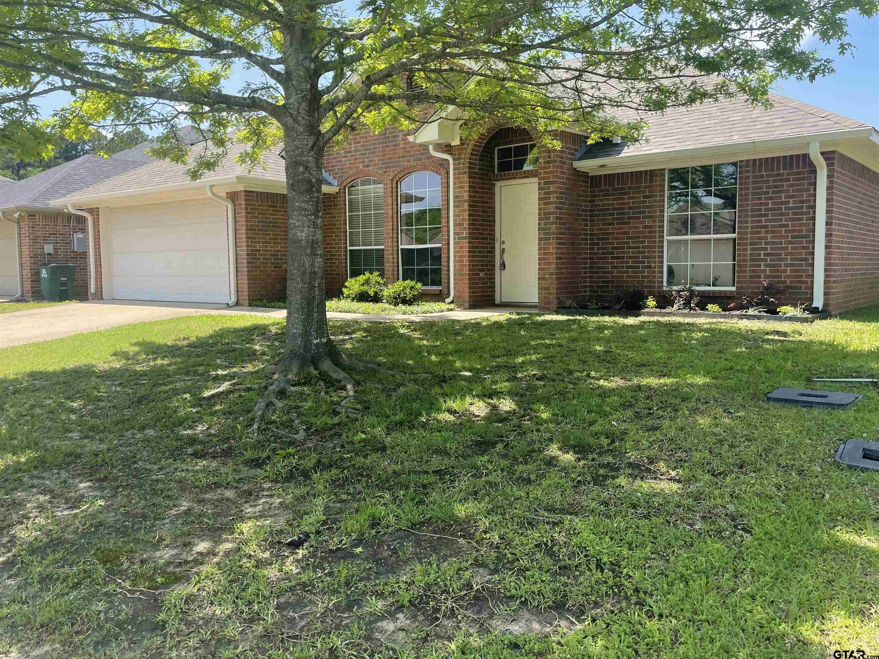213 Cass Circle Tyler, TX 75703 - Photo 15 of 44 front view of a house with a yard
