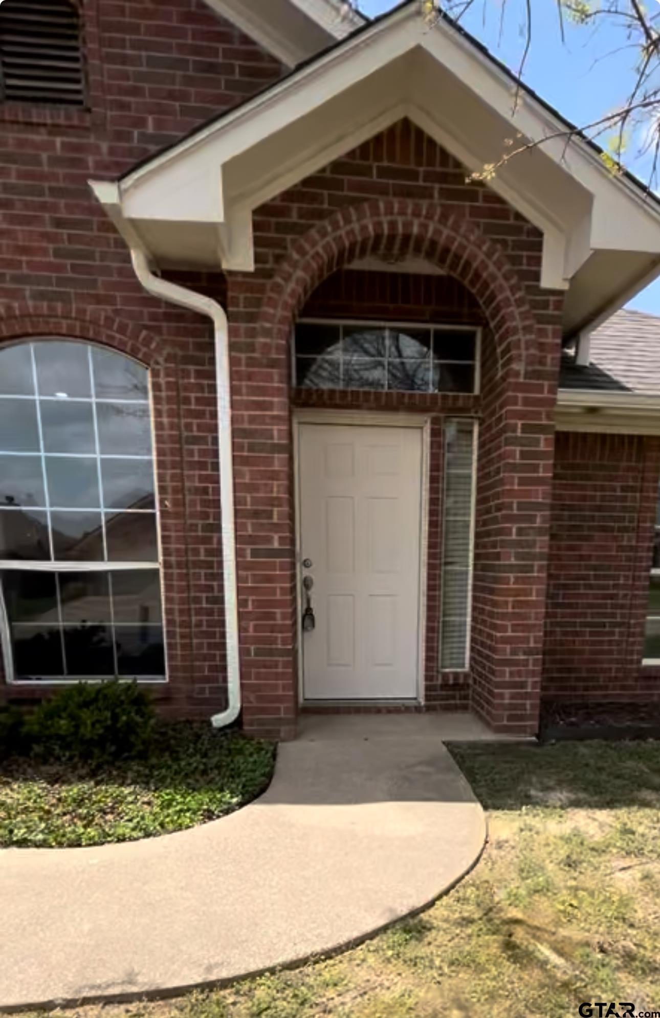 213 Cass Circle Tyler, TX 75703 - Photo 19 of 44 a front view of a house with a yard