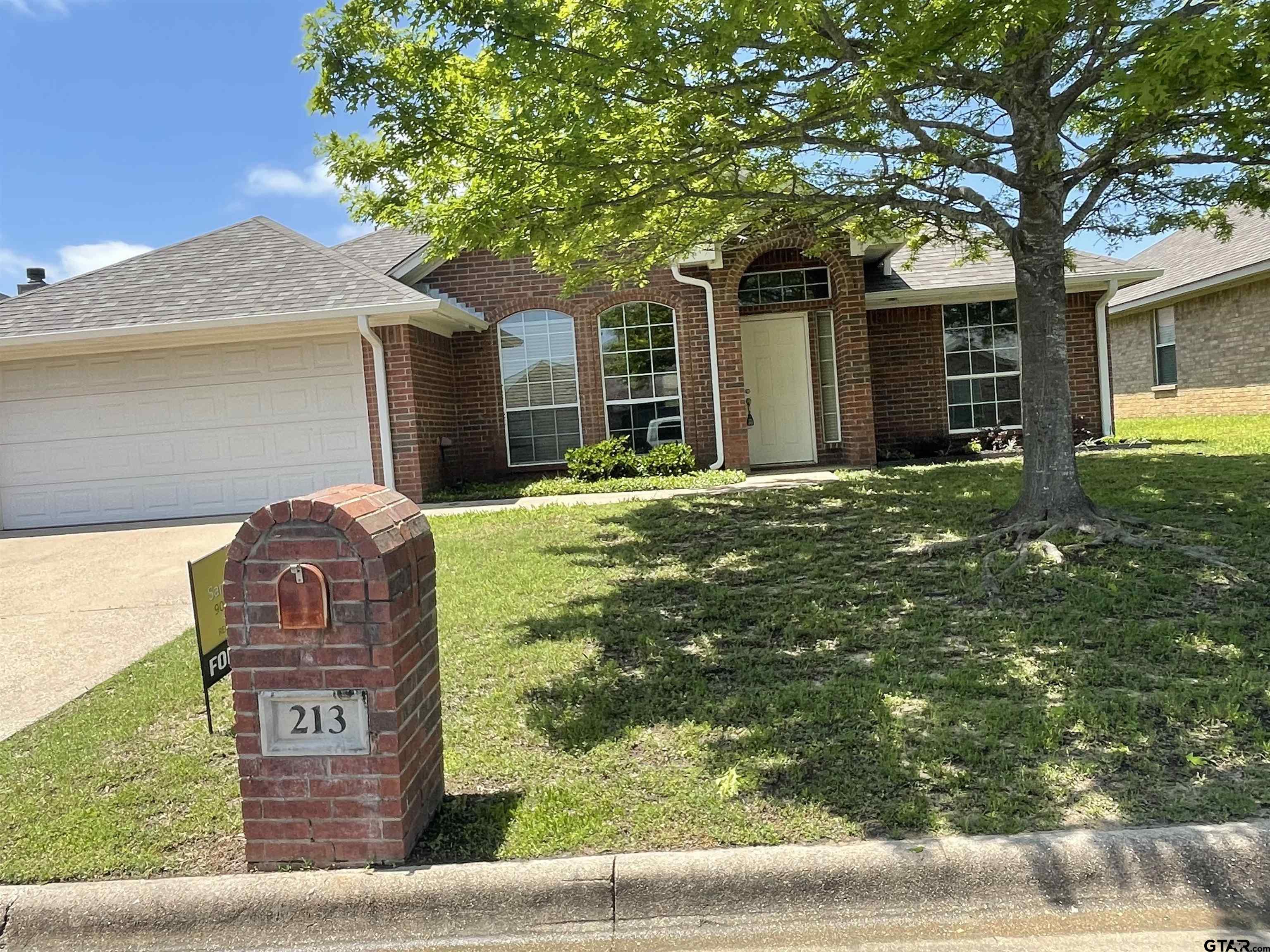 213 Cass Circle Tyler, TX 75703 - Photo 2 of 44 a view of a house with a back yard