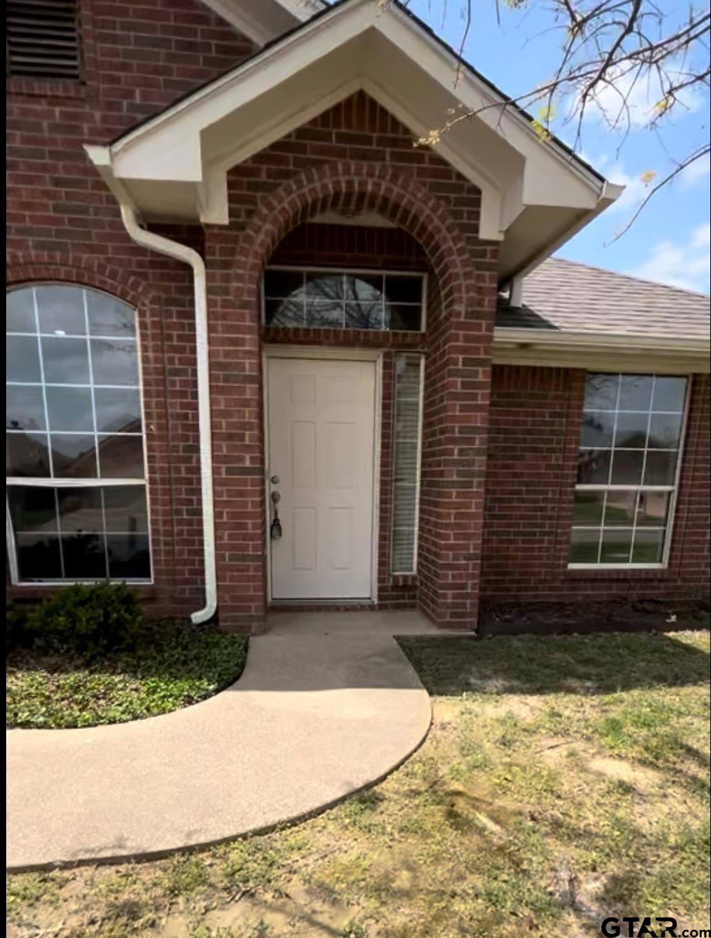 213 Cass Circle Tyler, TX 75703 - Photo 21 of 44 a front view of a house with a yard