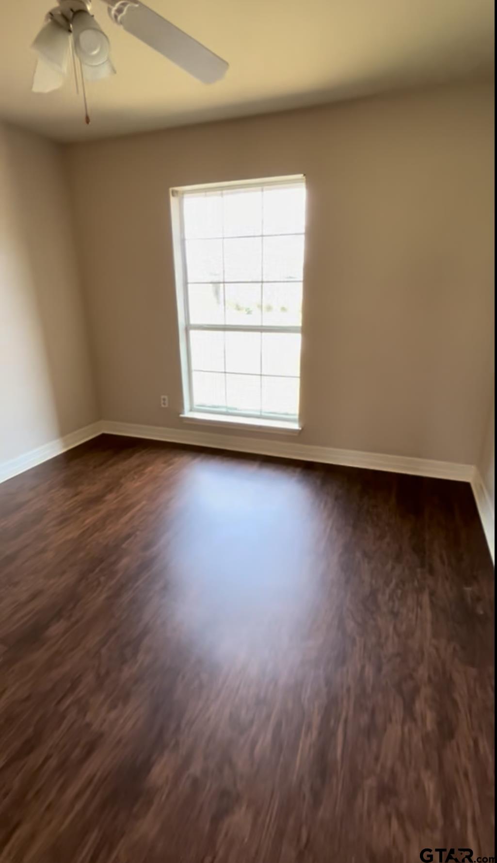 213 Cass Circle Tyler, TX 75703 - Photo 23 of 44 an empty room with wooden floor and windows