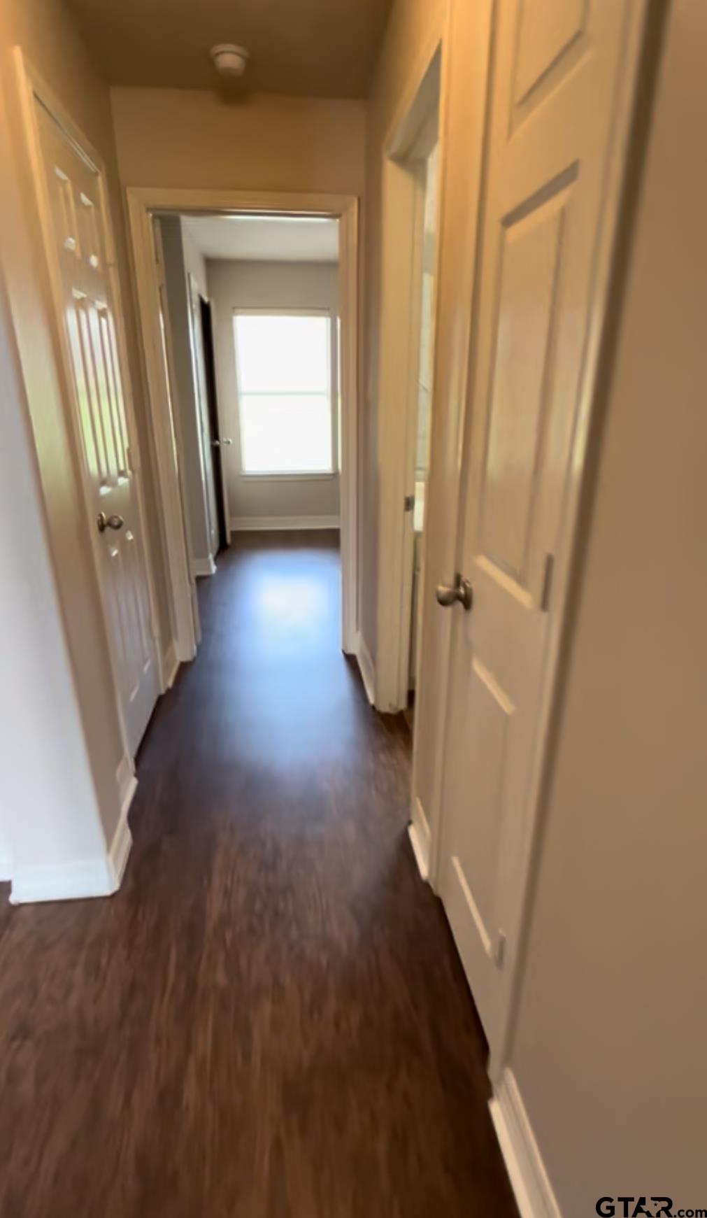 213 Cass Circle Tyler, TX 75703 - Photo 25 of 44 a view of a hallway with wooden floor and staircase