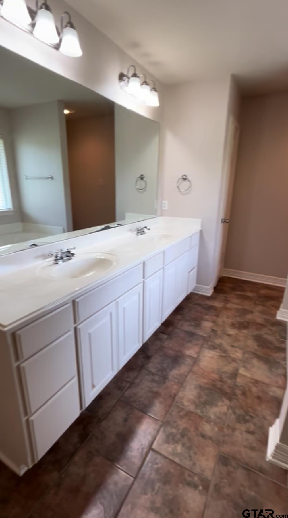 213 Cass Circle Tyler, TX 75703 - Photo 37 of 44 a spacious bathroom with a double vanity sink mirror and bathtub