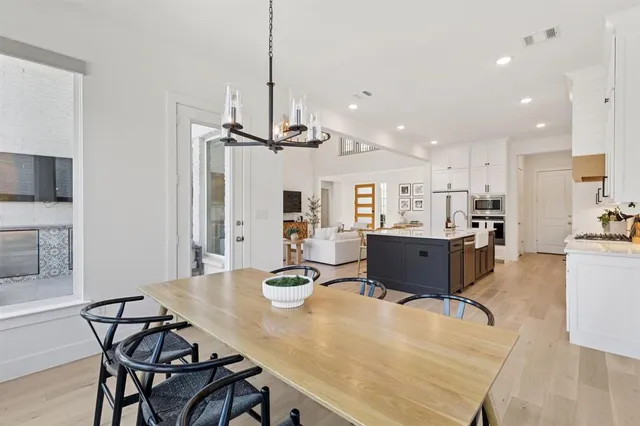 a living room with stainless steel appliances kitchen island granite countertop furniture and a kitchen view
