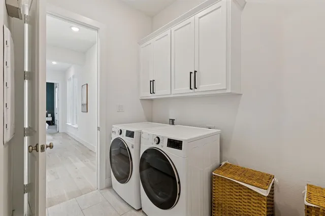 a view of a storage & utility room with washer and dryer