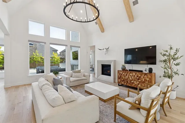 a living room with fireplace furniture and a flat screen tv