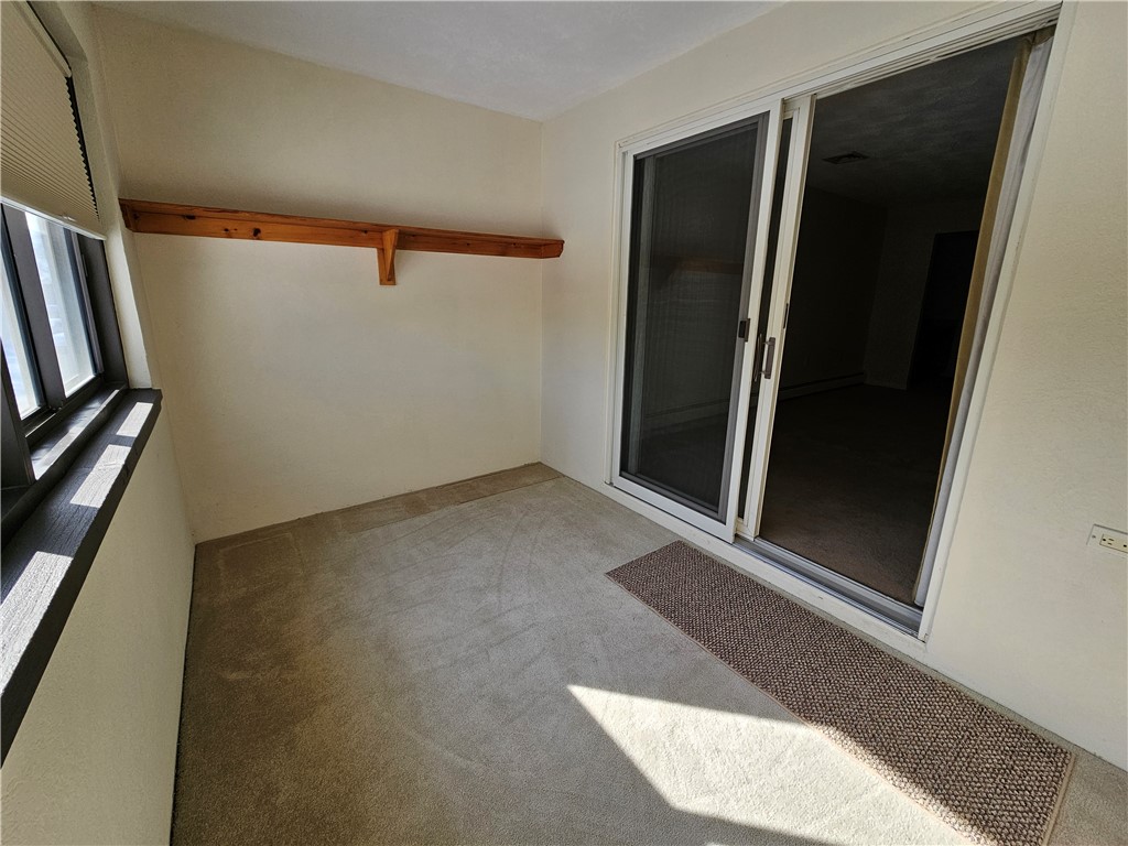 2970 Mendon Road, Unit 187 Cumberland, RI 02864 - Photo 27 of 34 Primary Bedroom Enclosed Porch