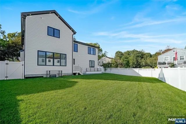 a front view of a house with a yard and porch