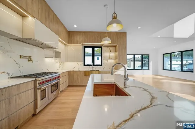 a kitchen with a stove a sink and a refrigerator