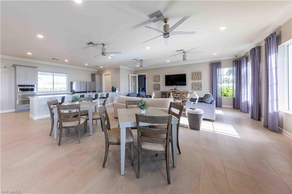882 Enbrook Loop Naples, FL 34114 - Photo 14 of 19 a view of a dining area with furniture window and wooden floor