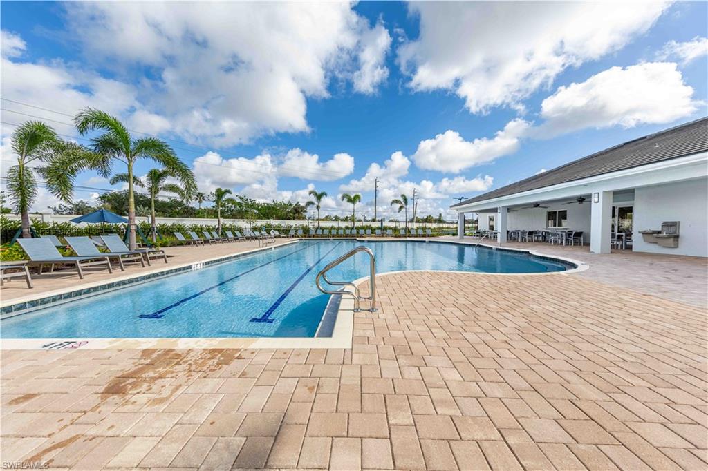 882 Enbrook Loop Naples, FL 34114 - Photo 19 of 19 a view of swimming pool with outdoor seating and plants