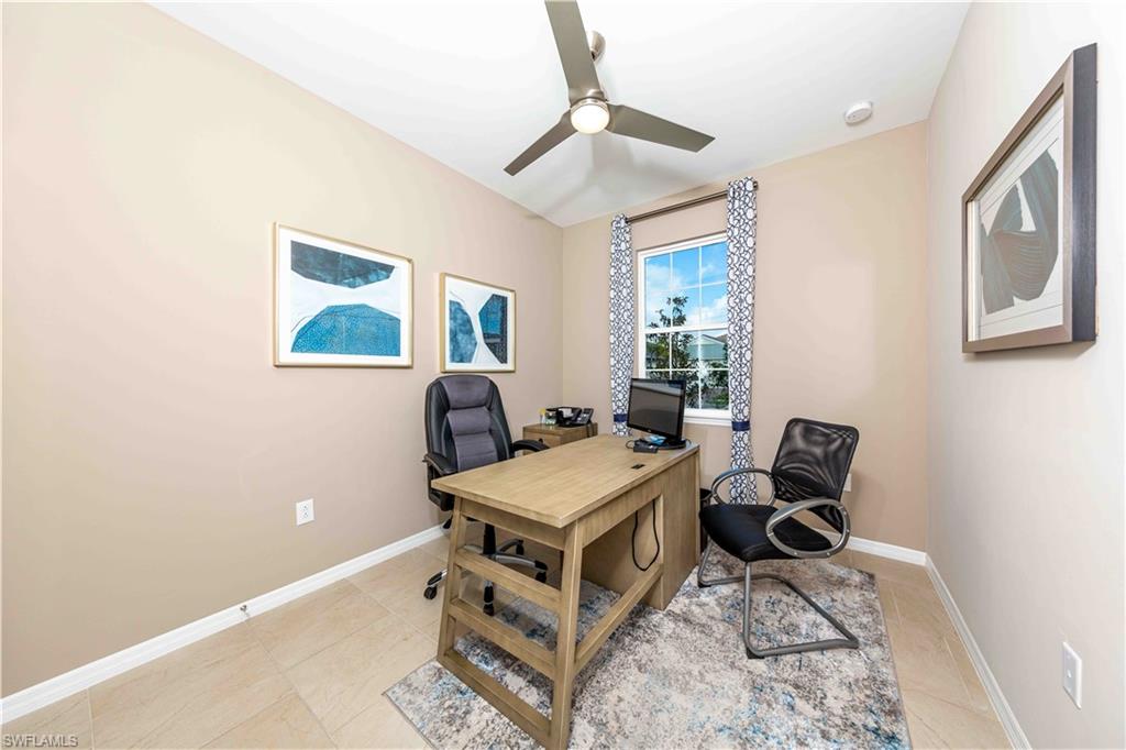 882 Enbrook Loop Naples, FL 34114 - Photo 10 of 19 a room with furniture and a window