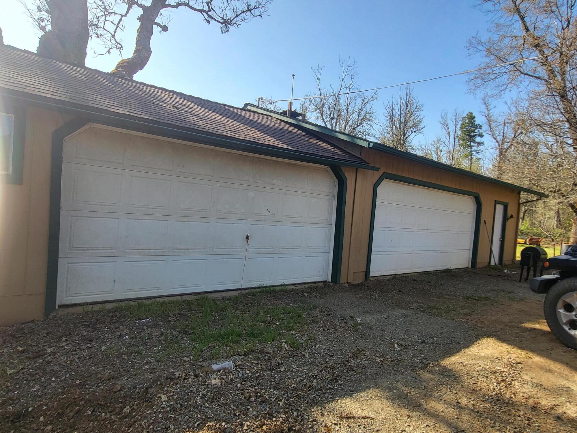 7750 Holland Loop Road Cave Junction, OR 97523 - Photo 2 of 12 a backyard of a house