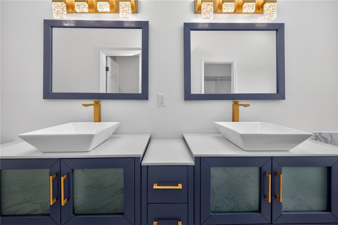 811 Wind Bluff Point Springboro, OH 45066 - Photo 19 of 51 This bathroom features two vessel sinks, offering convenience and ample space for daily routines.