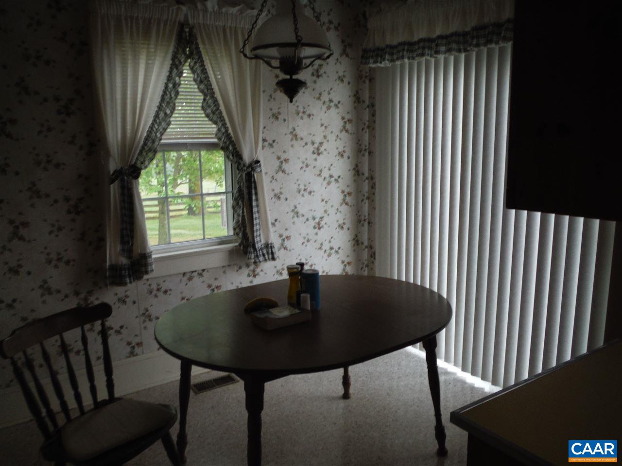 1270 Locust Grove Church Road Orange, VA 22960 - Photo 23 of 46 a view of a workspace with a table and chairs in a patio