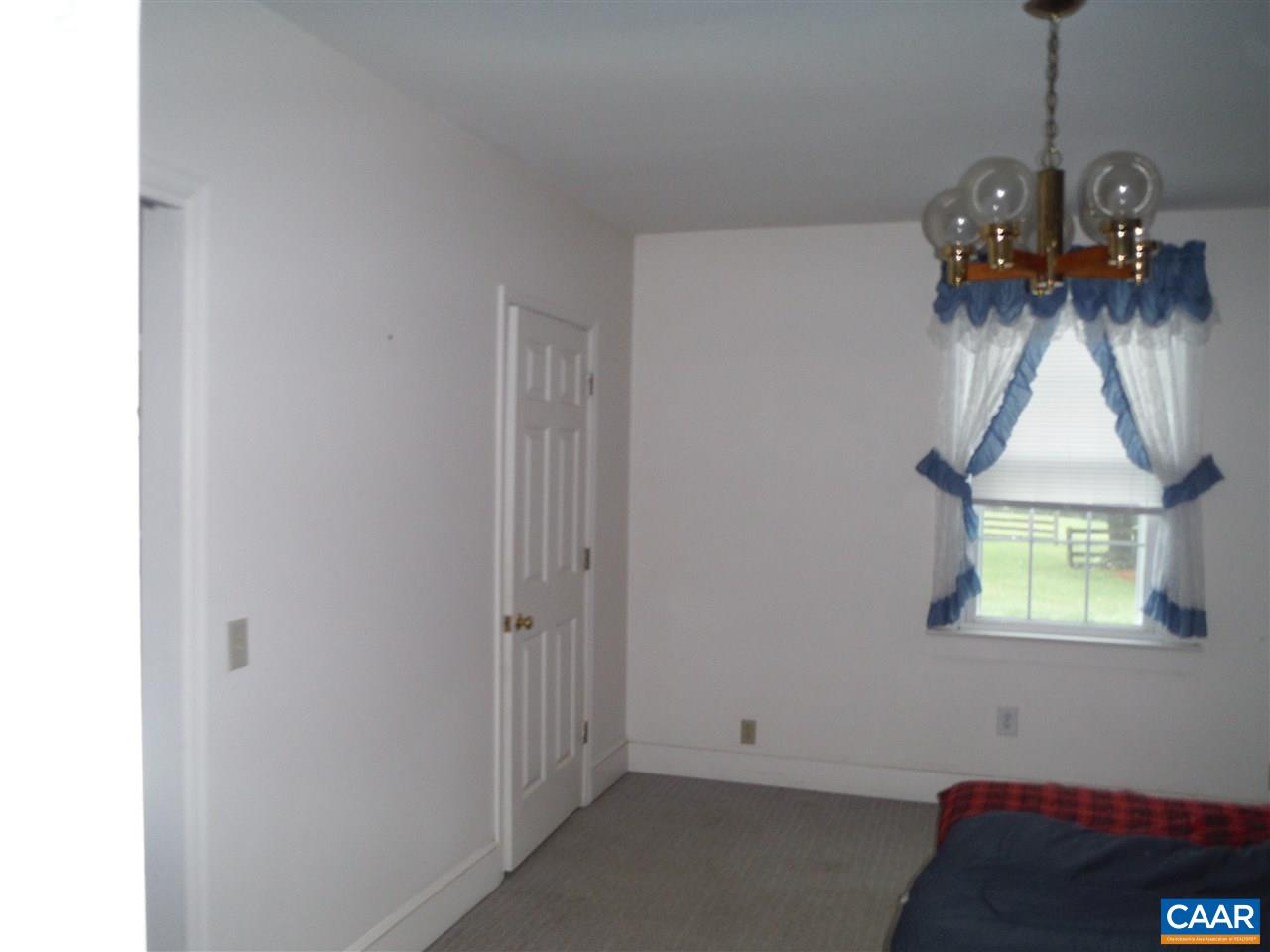 1270 Locust Grove Church Road Orange, VA 22960 - Photo 24 of 46 an empty room with a window and a chandelier