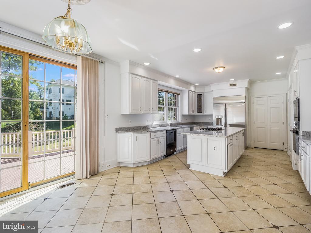 8951 Brook Road McLean, VA 22102 - Photo 12 of 32 a large white kitchen with a large window
