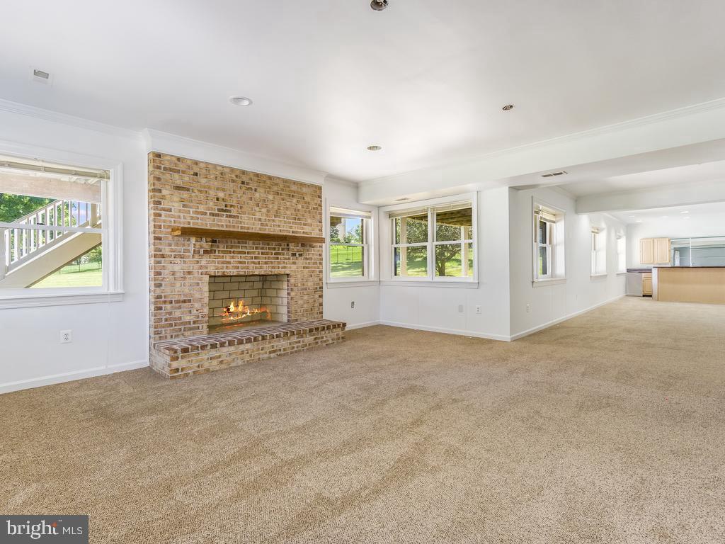 8951 Brook Road McLean, VA 22102 - Photo 26 of 33 Lower Level Rec Room - Virtually Staged FP Flame