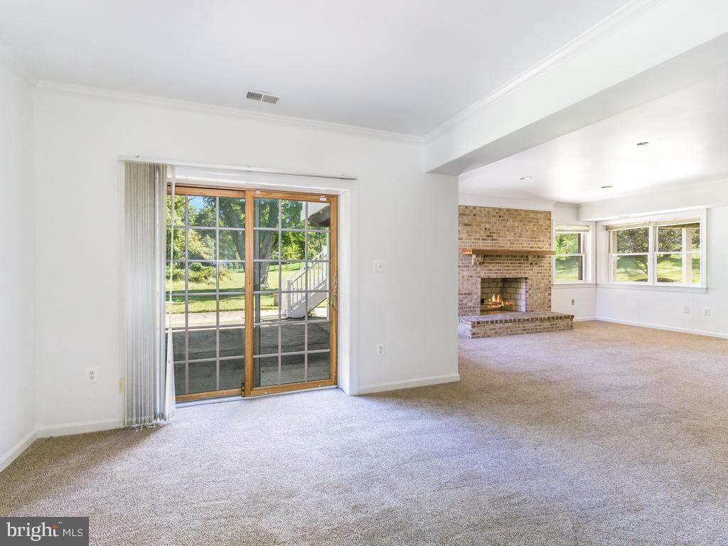 8951 Brook Road McLean, VA 22102 - Photo 27 of 33 Lower Level Walk-Out - Virtually Staged FP Flame