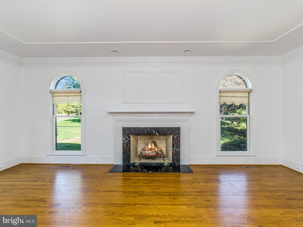 8951 Brook Road McLean, VA 22102 - Photo 6 of 32 a view of an empty room with window and fireplace